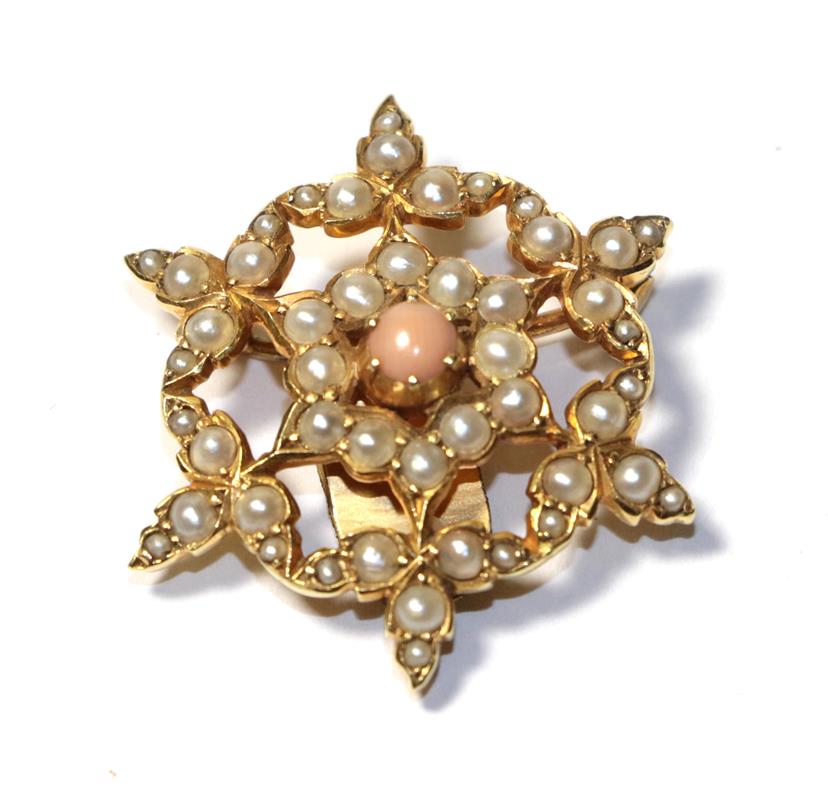 Lot 68 - A coral and split pearl brooch, the central round cabochon coral within a border of split...