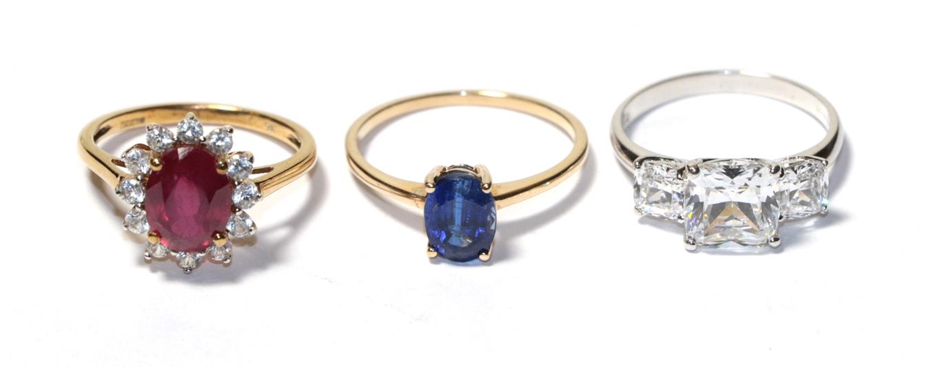 Lot 75 - A 9 carat gold kyanite solitaire ring, finger size P1/2, a 14 carat white gold cubic zirconia three