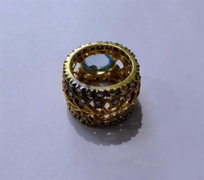 Lot 86 - A blue topaz and diamond ring, unmarked, finger size Q