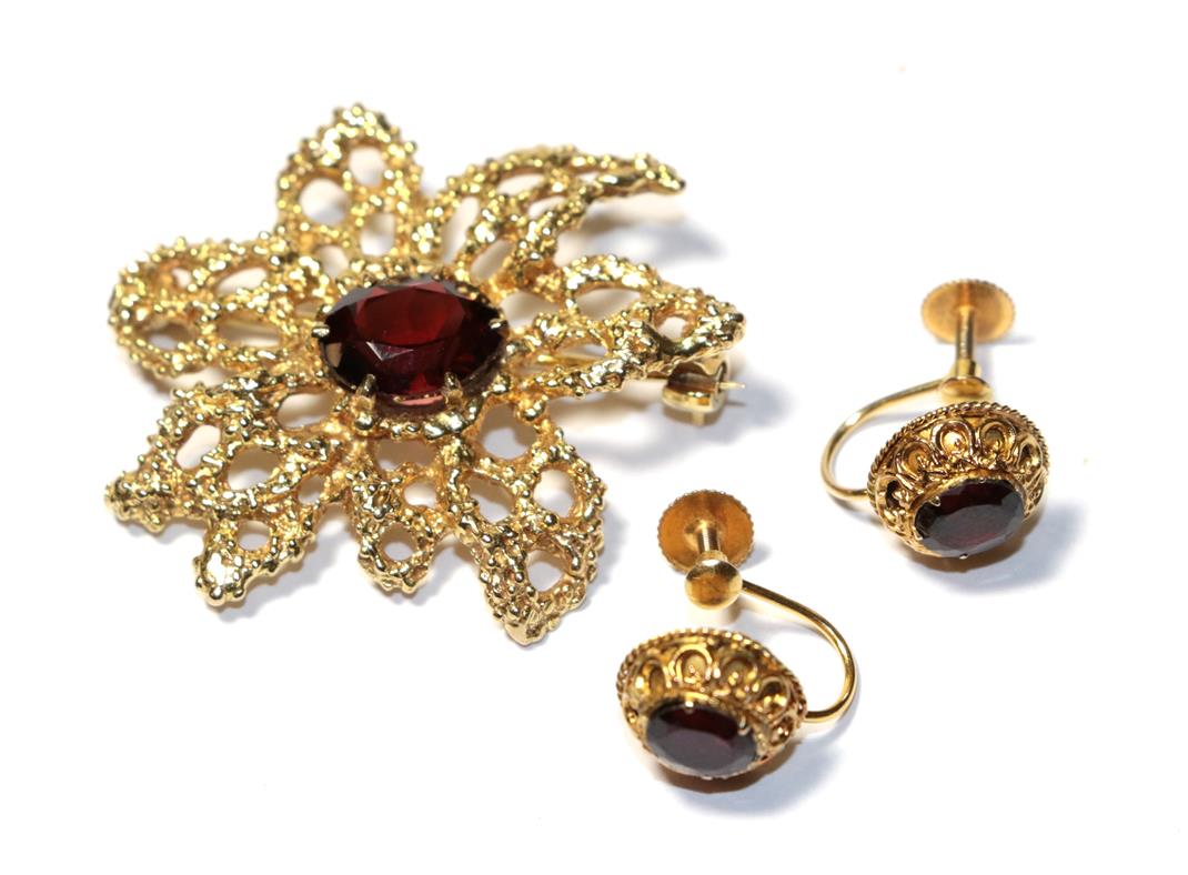 Lot 93 - A 9 carat gold garnet brooch, length 3.7cm and a pair of garnet earrings, stamped '9CT', with screw