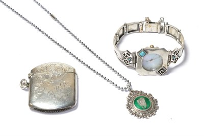 Lot 106 - A silver vesta case, Birmingham assay mark, a silver and enamelled fob, Irish harp motif,...