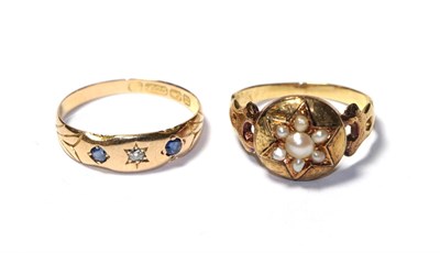 Lot 108 - An Edwardian split pearl mourning ring, a split pearl star motif with a locket compartment to...