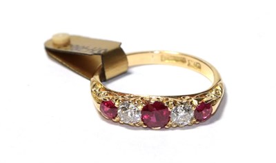 Lot 112 - A synthetic ruby and diamond five stone ring, three graduated round cut synthetic rubies...