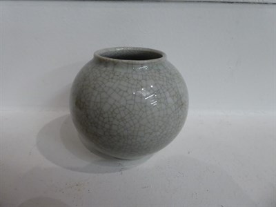 Lot 140 - A Chinese Guan-type water pot, in Song style, of ovoid shape with everted rim and crackle...