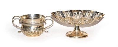 Lot 149 - A Victorian silver porringer by Wakely & Wheeler assayed London 1887, together with a George V...