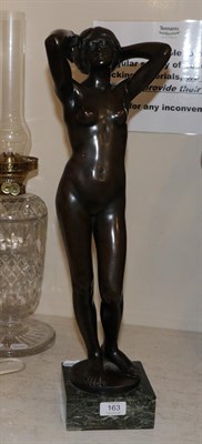 Lot 163 - A bronze resin sculpture of a nude maiden on a marble base, 58cm high