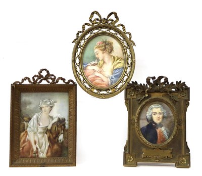 Lot 189 - Three early 20th century portrait miniatures in gilt metal easel frames, one signed Denise (3)