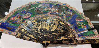 Lot 199 - Two Chinese fans in lacquered cases decorated in gilt with figures in landscape settings, the...