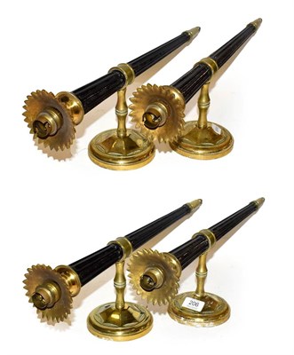 Lot 206 - Set of four black-painted and brass torch wall lights, back plates 11.5 cm diameter, 52cm (4)
