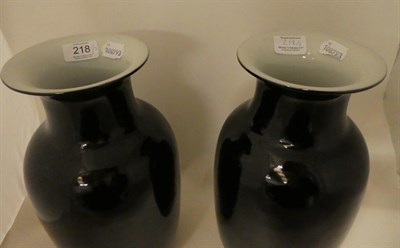 Lot 218 - A pair of Chinese porcelain mirror black glazed vases, late Qing/republic period, of lantern shape