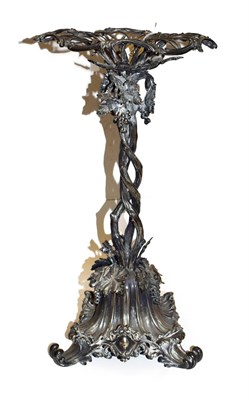 Lot 220 - An Elkington & Co silver plated centre piece adorned with fruiting vines and raised on scroll...