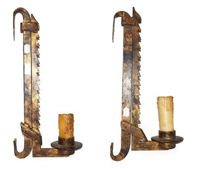 Lot 221 - A pair of heavy iron adjustable saw-edge wall lights, 52.5cm (2)