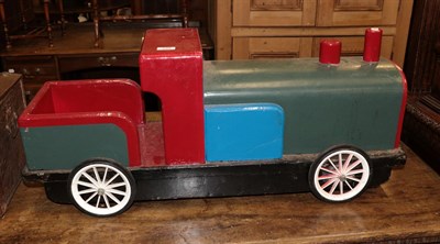 Lot 248 - A scratch built painted wooden child's push along toy train, complete with metal valves inside...