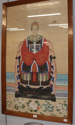 Lot 260 - A framed Chinese portrait of an Empress seated upon a throne, dressed in silk robe with rank badge