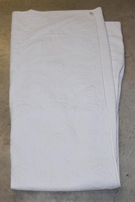 Lot 1107 - A 20th century white quilt, worked with clover heads overall