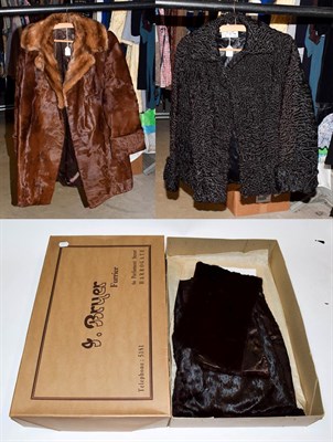 Lot 1151 - Brown hide Jacket with musquash collar, brown ermine stole, J Bryer black astracan short jacket (3)