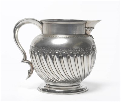 Lot 296 - A Victorian Jug, Atkin Bros, Sheffield 1898, of part fluted baluster form with scroll handle...