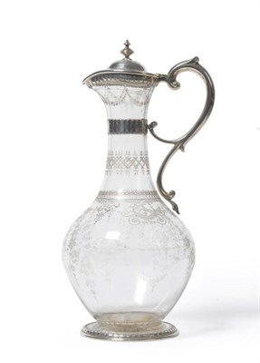 Lot 300 - A Victorian Silver Mounted Claret Jug, John Figg, London 1875, the bulbous glass body engraved with