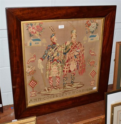 Lot 1214 - A Victorian woolwork picture in cushioned mahogany frame, portrait of a pair of Highlanders and...