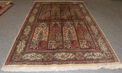 Lot 1250 - Tabriz Carpet, the field with columns of Mihrabs enclosed by cartouche borders, 306cm by 200cm