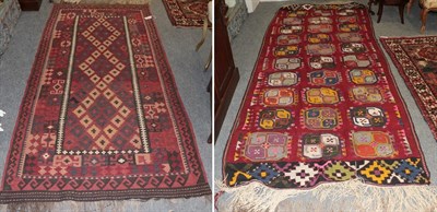 Lot 1254 - Afghan Uzbek flat weave rug, the raspberry field with three columns of guls enclosed by saw...