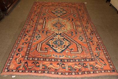 Lot 1257 - Afghan Carpet, the terracotta field with central medallion framed by 'S' motif borders, 286cm...