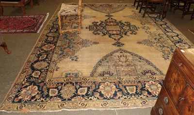 Lot 1266 - Tabriz carpet, the mustard field with indigo central medallion framed by wide indigo borders...