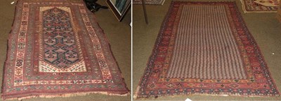 Lot 1268 - Khamsela rug 19th century, the field of bands enclosed by borders of flower heads and vines,...