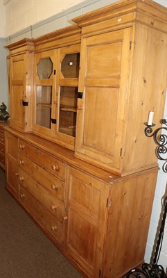 Lot 1272 - An early 19th century pine kitchen dresser / housekeepers cupboard with glazed reverse break...
