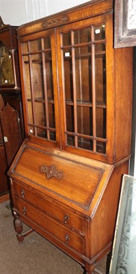Lot 1273 - A 1920s oak bureau bookcase, 90cm by 44cm by 194cm