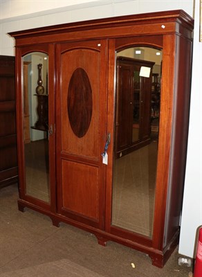 Lot 1278 - An Edwardian mahogany triple mirror front wardrobe with satinwood banding, 187cm by 50cm by 208cm