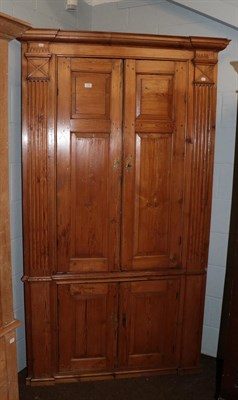 Lot 1280 - An early 19th century pine standing corner cupboard with fluter pilaster supports and having...