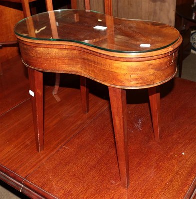 Lot 1287 - A 19th century mahogany kidney shaped bidet raised on splay supports, 31cm by 55cm by 47cm