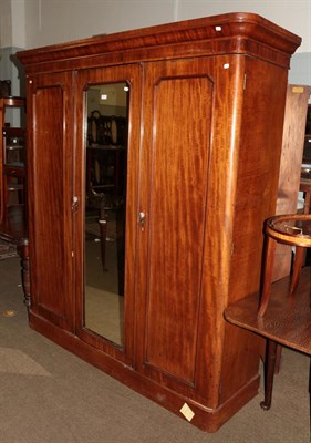 Lot 1291 - A Victorian mahogany mirror front triple wardrobe with fitted centre section, 174cm by 50cm by...