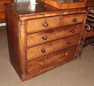 Lot 1309 - A Victorian mahogany chest of drawers, two short over three long, cross banded on turned column...