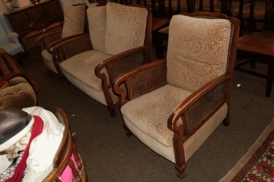 Lot 1313 - A cane work three piece seat, comprising a two-seater settee and a pair of armchairs