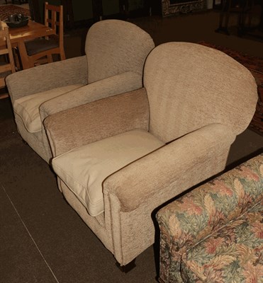 Lot 1319 - A pair of upholstered armchairs, raised on mahogany block feet (2)