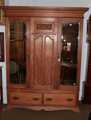 Lot 1343 - A Victorian carved oak mirror front double wardrobe (with key) 160cm by 50cm by 214cm