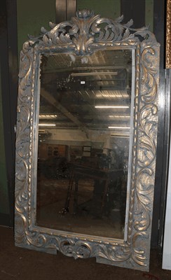 Lot 1346 - A large imposing parcel gilt mirror with scrolling open work pediment and further scroll work...