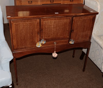 Lot 1353 - An Edwardian mahogany sideboard with strung inlay raised on slender square tapering supports, 106cm