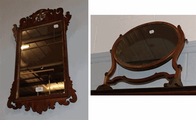 Lot 1356 - A walnut and parcel gilt fret cut mirror, 65cm by 37cm together with a mahogany framed dressing...