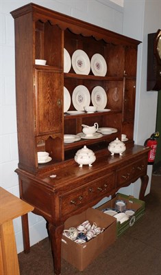 Lot 1358 - A 19th century oak dresser and rack, the upper section with scroll carved apron, the base...