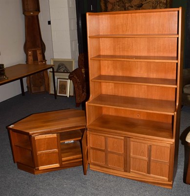 Lot 1363 - A 1970's Nathan teak open bookcase, 84cm by 34cm by 158cm and matching low cabinet, 99cm by 49cm by