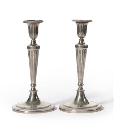 Lot 317 - A Pair of George III Table Candlesticks, John Scofield, circa 1790, each with beaded and...