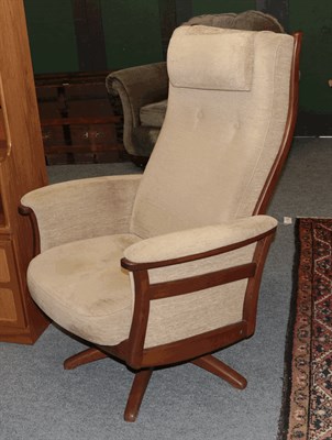 Lot 1364 - A retro teak framed swivel armchair