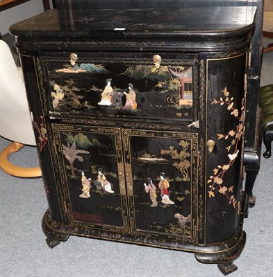 Lot 1368 - A Chinese lacquered cocktail cabinet with ivory and hard stone applied decoration depicting figures