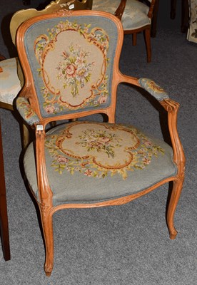 Lot 1375 - An early 20th century carved walnut fauteuil with needlework upholstery