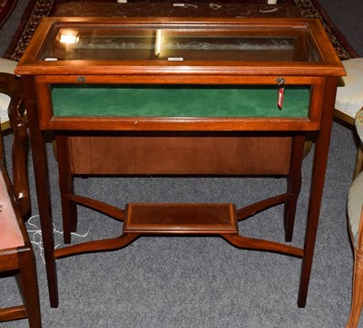 Lot 1376 - A Victorian mahogany bijouterie table, cross-banded in satinwood raised on square tapering...