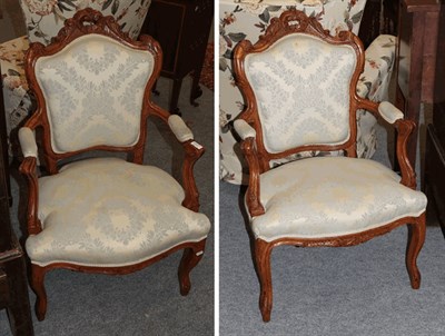 Lot 1379 - A pair of French style gilt carved salon armchairs