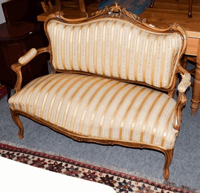 Lot 1386 - A French style carved walnut two seat settee